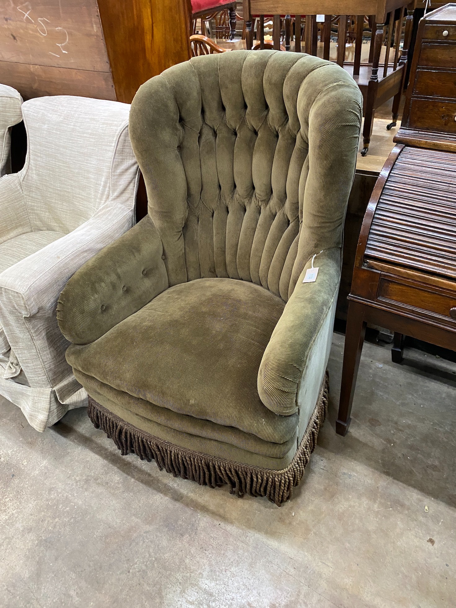 A Victorian style buttoned cord fabric spoonback rocking armchair, width 78cm, depth 70cm, height 110cm